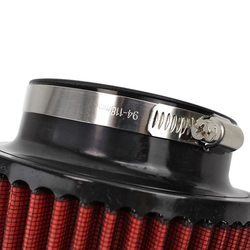Close-up of a black air filter with red mesh and a metal clamping mechanism on a white background.